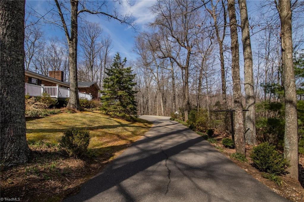 190 Brim Road Mount Airy, NC 27030 - Photo 11 of 49 Asphalt drive goes all the way around the home.