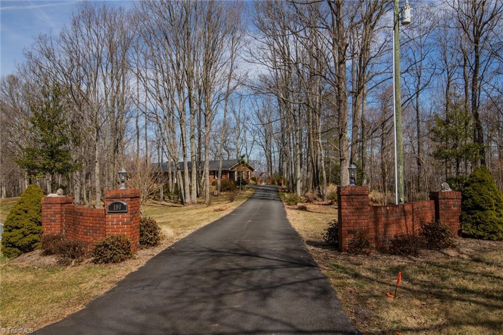 190 Brim Road Mount Airy, NC 27030 - Photo 12 of 49 Nice long private driveway circles all the way around the home.