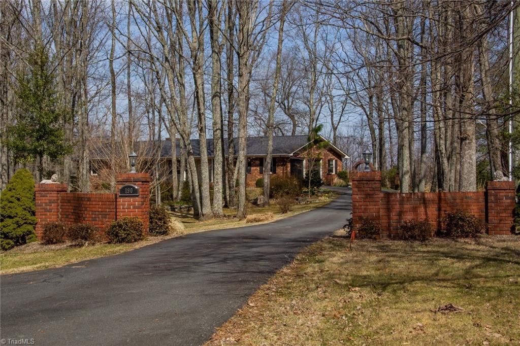 190 Brim Road Mount Airy, NC 27030 - Photo 3 of 49 Magically landscaped sitting far off the road.