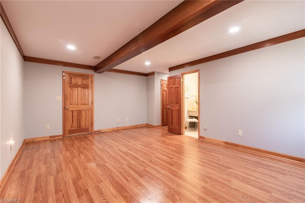 190 Brim Road Mount Airy, NC 27030 - Photo 25 of 49 Large Master bedroom and master bedroom with beautiful exposed beams and canister lighting.