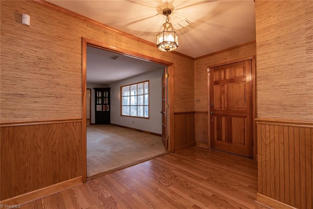 190 Brim Road Mount Airy, NC 27030 - Photo 32 of 49 Large Foyer front entrance, beautiful solid door. Last owner had a massive marble table in it with a beautiful floral arrangement. It was stunning and made such a statement. Just think what you could do with this space!!!