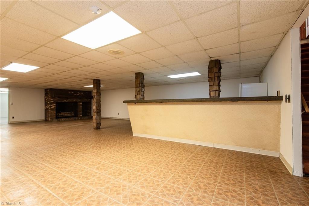 190 Brim Road Mount Airy, NC 27030 - Photo 39 of 49 HUGE living area in the basement with a massive gorgeous fireplace.