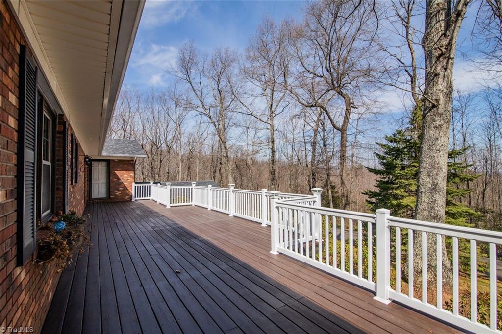 190 Brim Road Mount Airy, NC 27030 - Photo 7 of 49 A massive deck skirts the back of the house.
