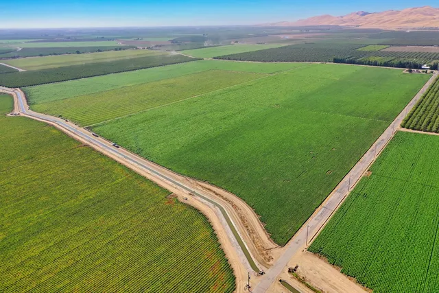 a view of a field with an outdoor space