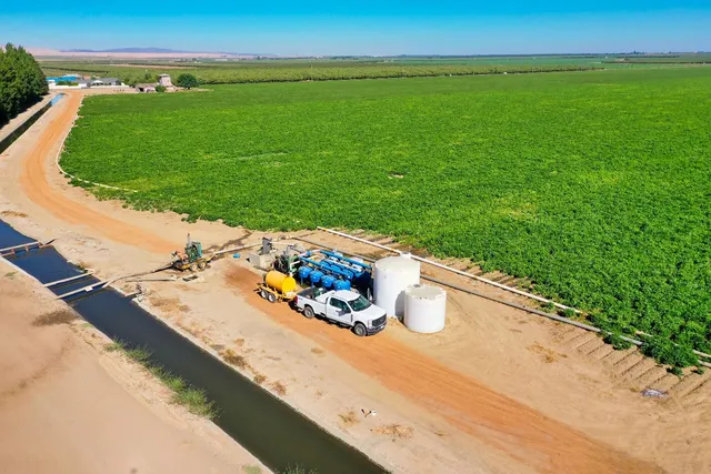 a view of a swimming pool with a yard