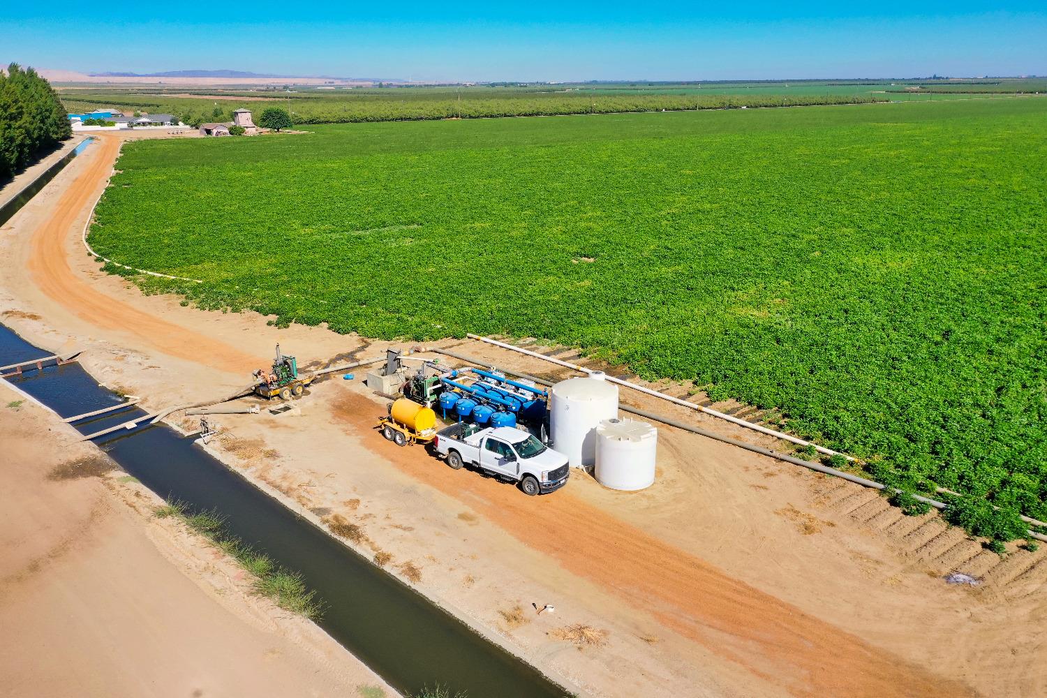 4942 McCracken Road Westley, CA 95387 - Photo 7 of 15 a view of a swimming pool with a yard
