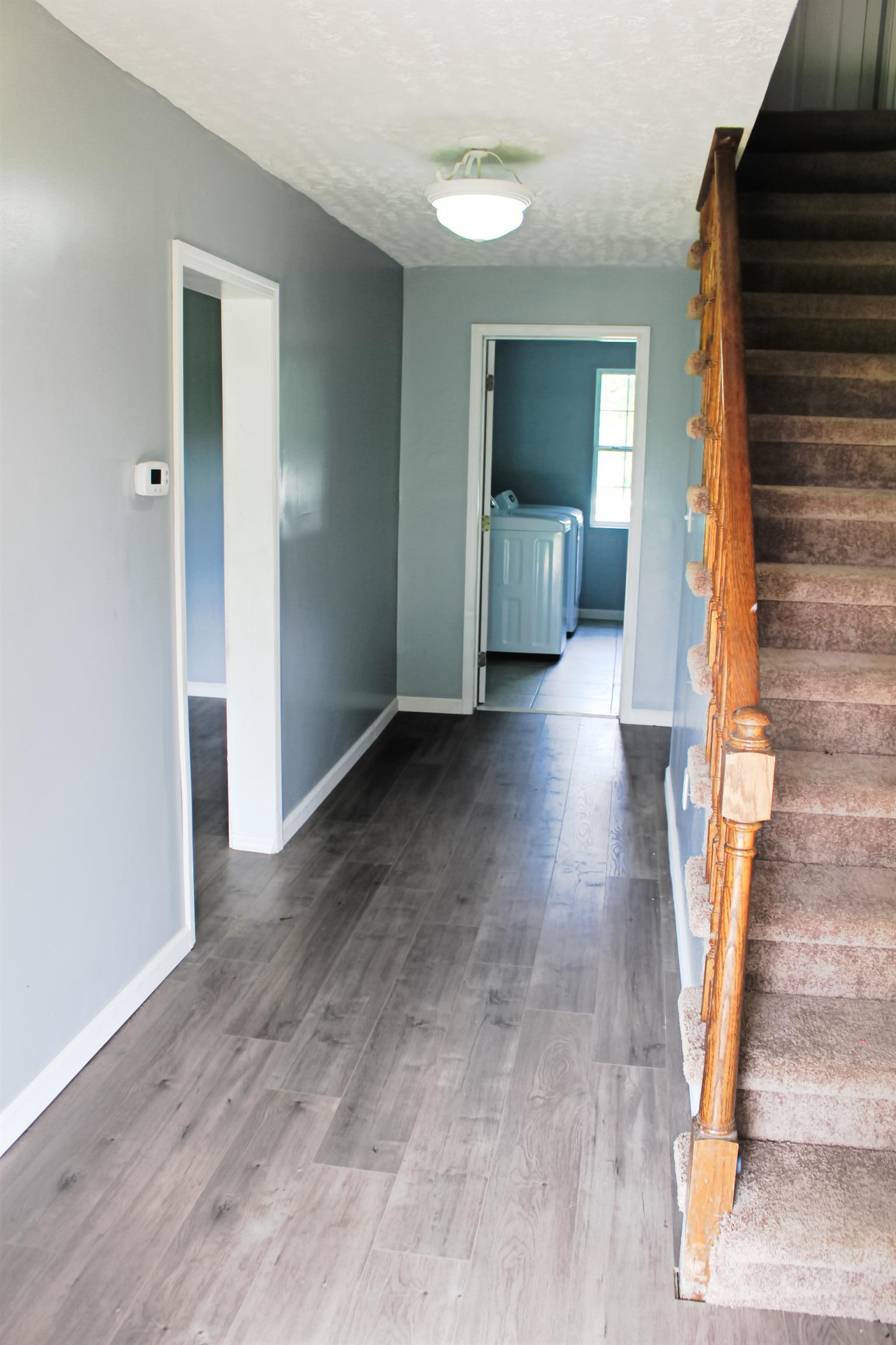 2454 Goshen Road Lebanon, TN 37087 - Photo 2 of 18 a view of a hallway with wooden floor and entryway