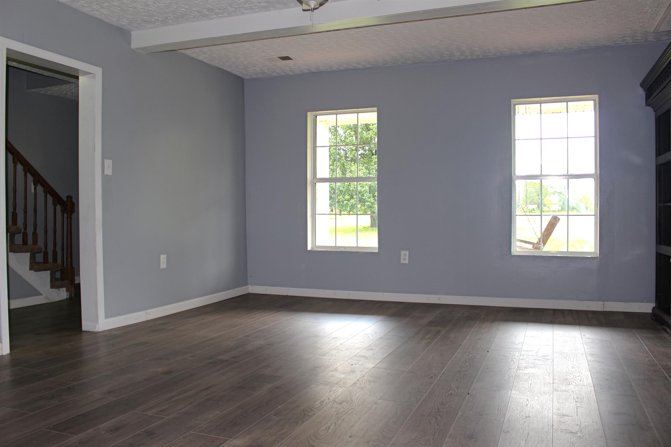 2454 Goshen Road Lebanon, TN 37087 - Photo 14 of 18 an empty room with wooden floor and windows