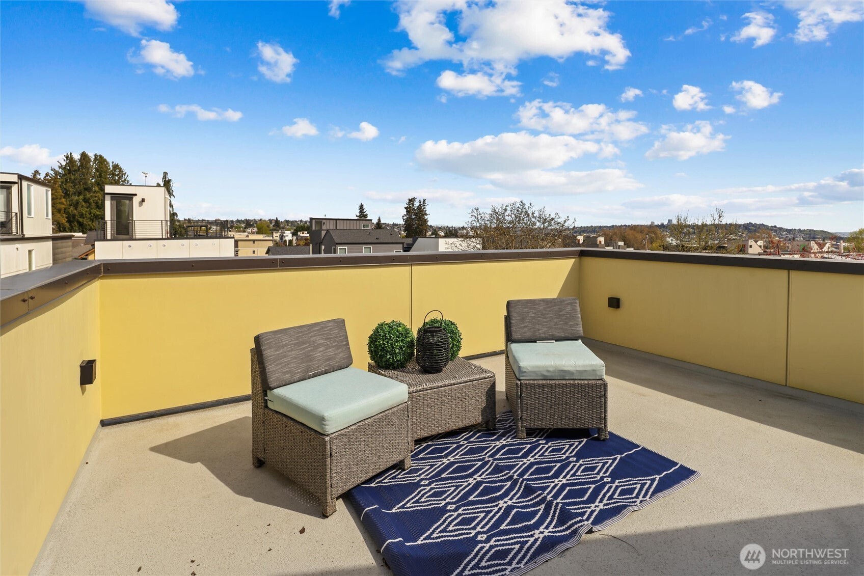 2653 Northwest 64th Street, Unit A Seattle, WA 98107 - Photo 14 of 32 a view of a terrace with couches and ocean view