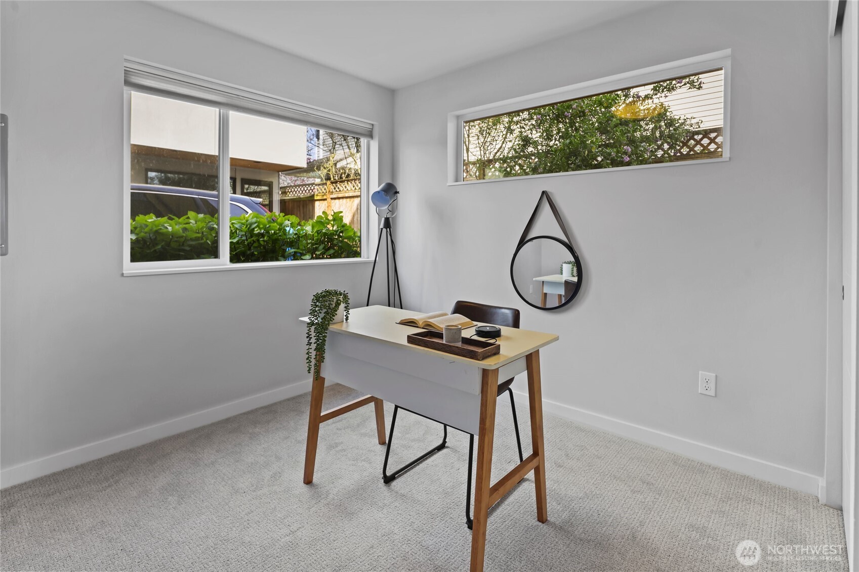 2653 Northwest 64th Street, Unit A Seattle, WA 98107 - Photo 21 of 32 a table and chairs in a room next to a window