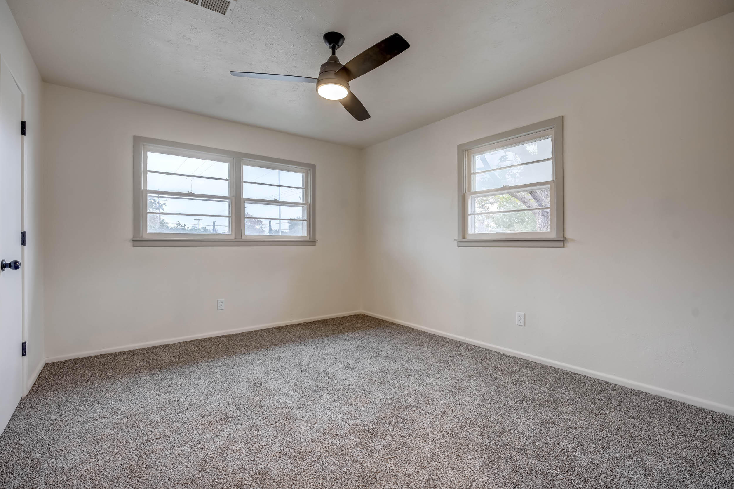 2101 64th Street Lubbock, TX 79412 - Photo 22 of 30 a view of an empty room with a window
