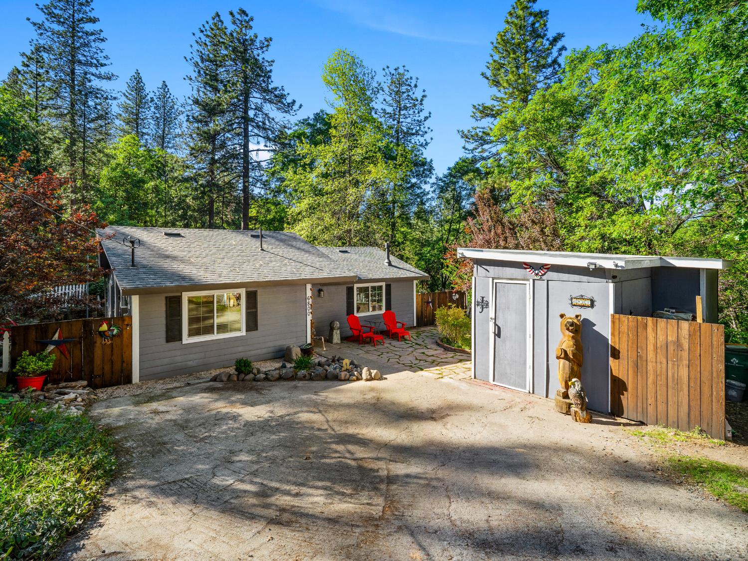 a view of a house with a patio and a yard