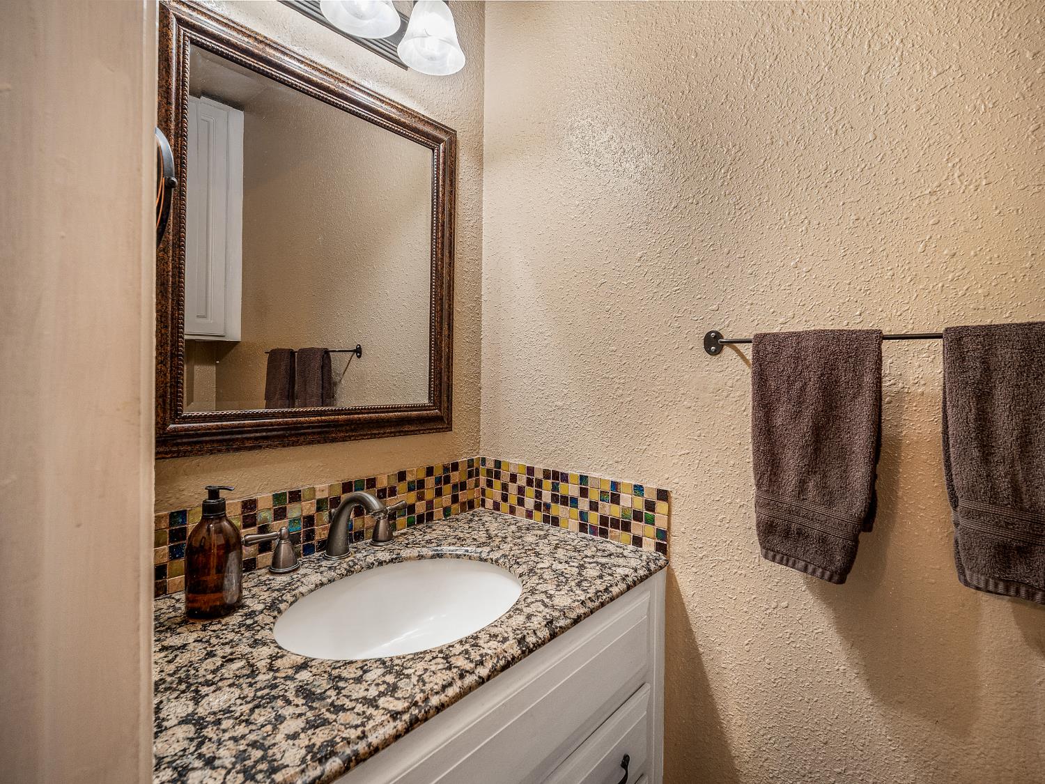 6800 Diablo View Trail Placerville, CA 95667 - Photo 21 of 33 a bathroom with a granite countertop sink and a mirror
