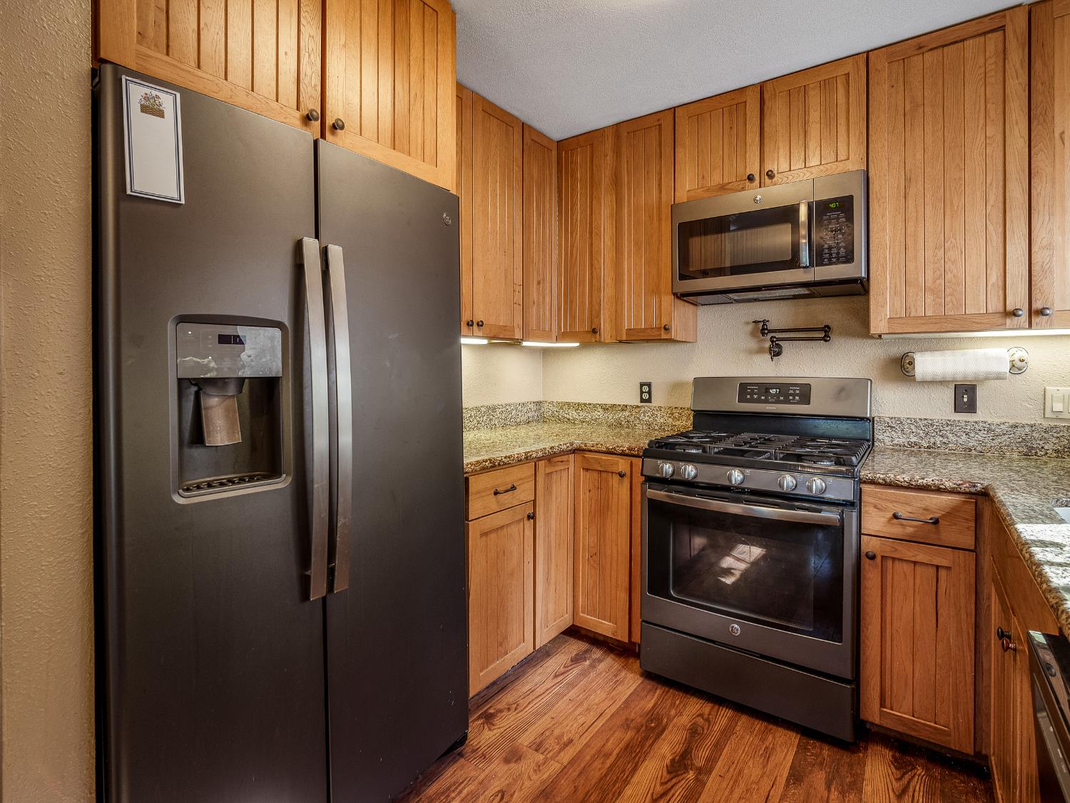 6800 Diablo View Trail Placerville, CA 95667 - Photo 29 of 33 a kitchen with stainless steel appliances granite countertop a refrigerator stove and microwave