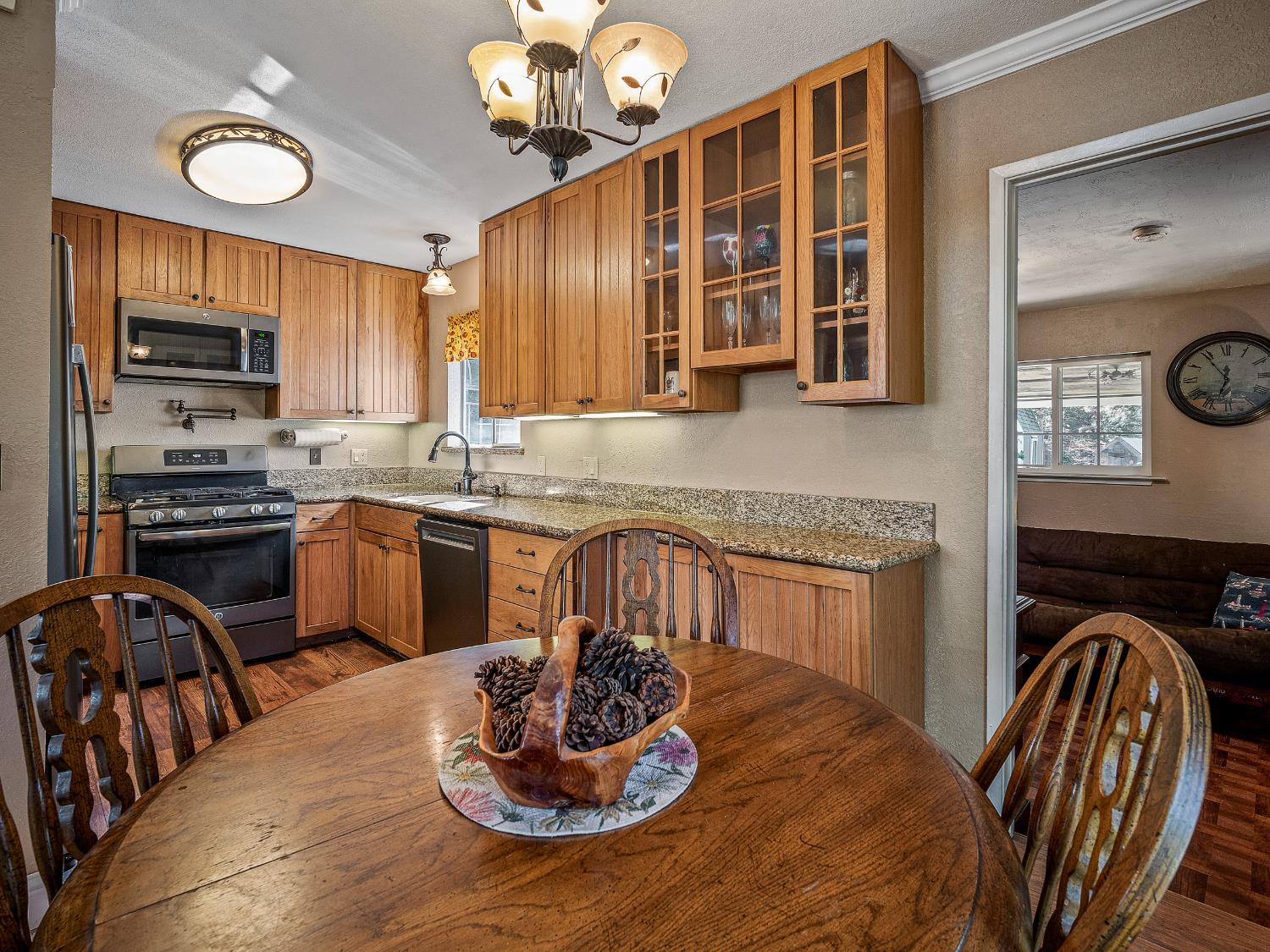 6800 Diablo View Trail Placerville, CA 95667 - Photo 30 of 33 a kitchen with a table chairs stove and microwave