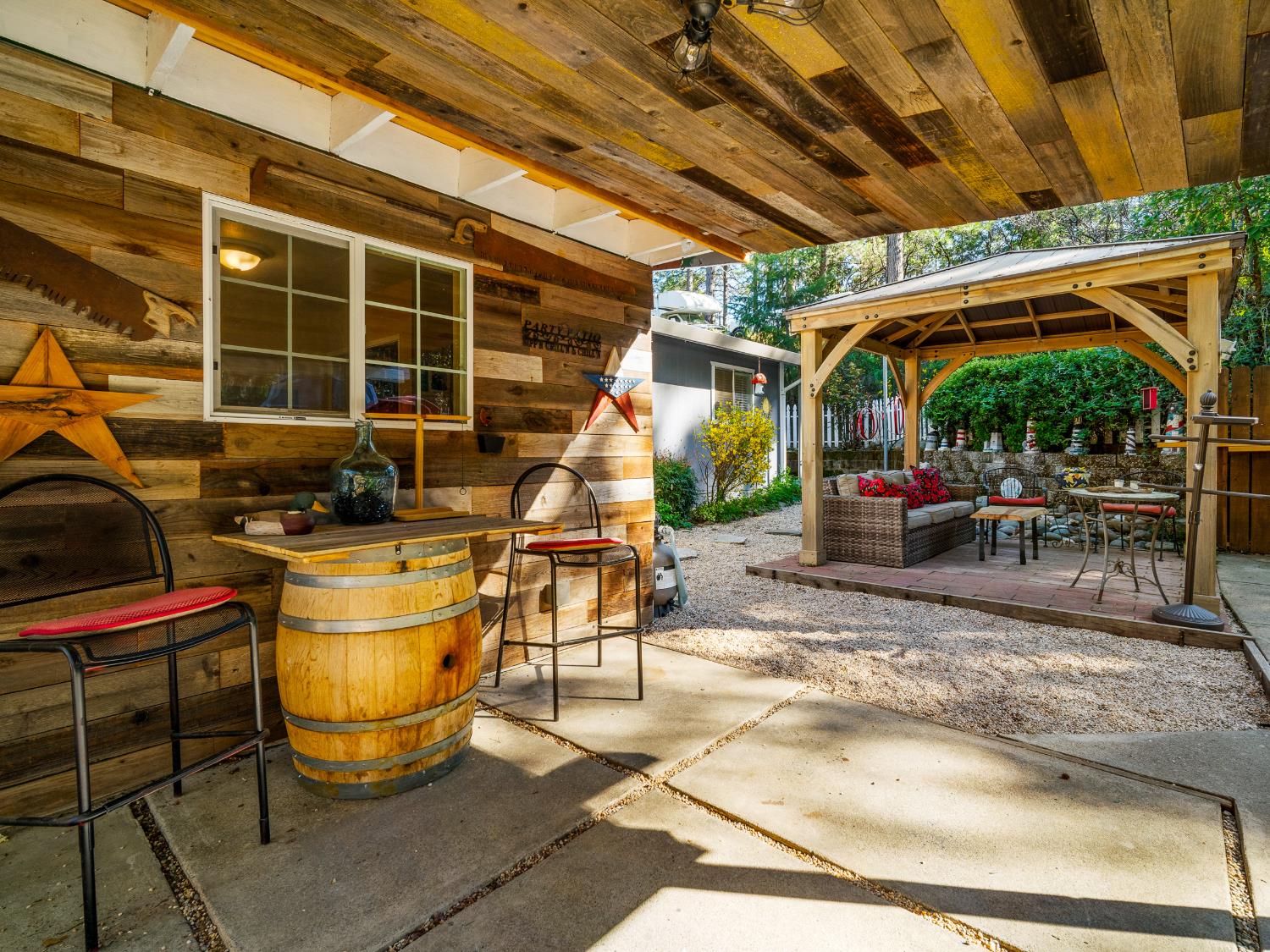 6800 Diablo View Trail Placerville, CA 95667 - Photo 6 of 33 a view of a patio with table and chairs next to a yard