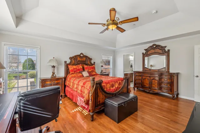 a bedroom with furniture and a window