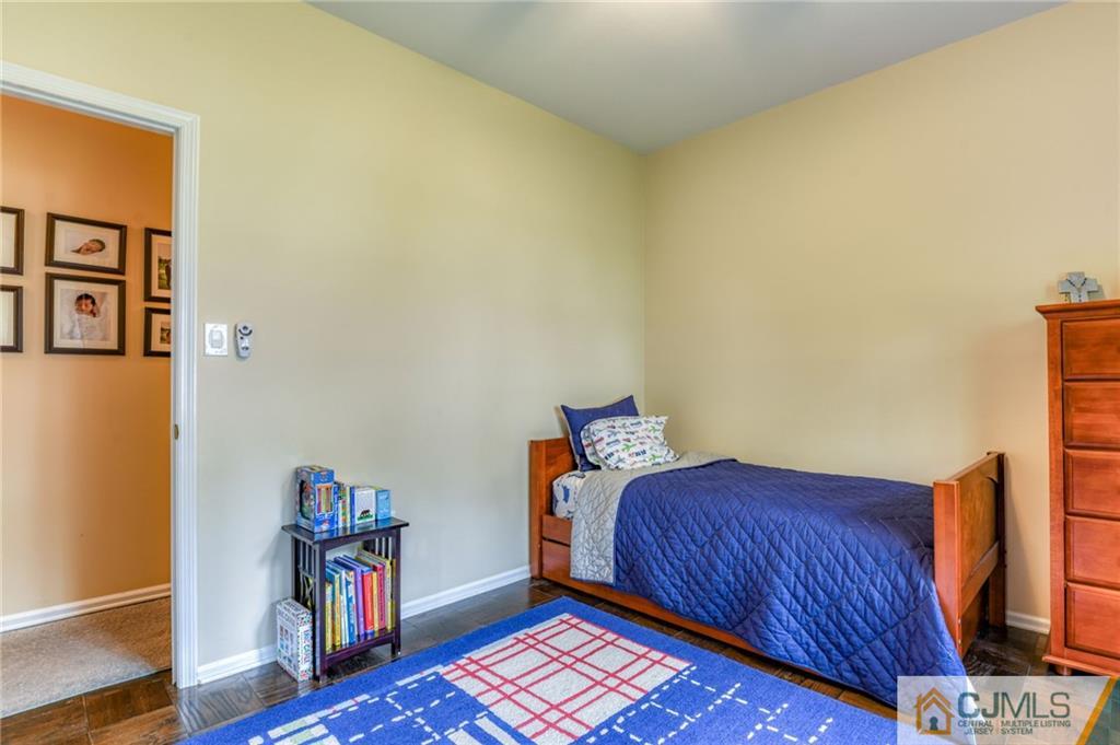 3 Spruce Lane Princeton, NJ 08540 - Photo 25 of 34 a bedroom with a bed and wooden floor