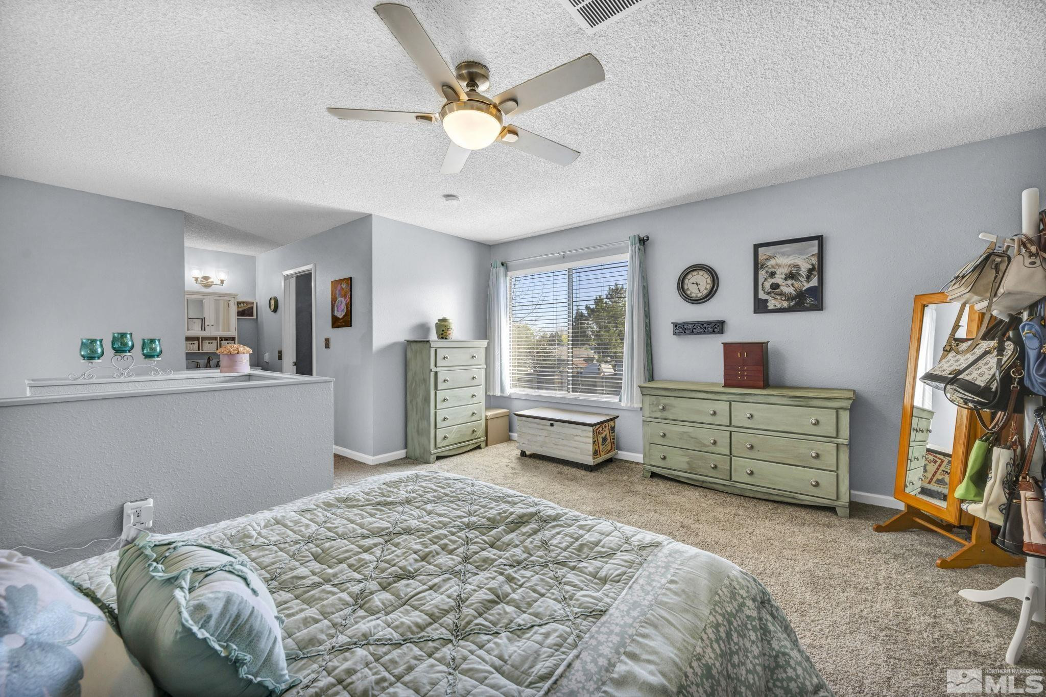 4721 Reggie Road Reno, NV 89502 - Photo 16 of 33 a bedroom with a bed and a window