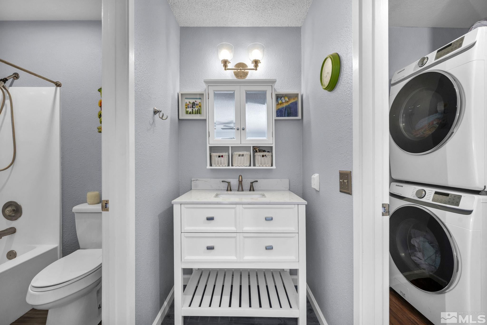 4721 Reggie Road Reno, NV 89502 - Photo 20 of 33 a bathroom with a sink a toilet and a shower