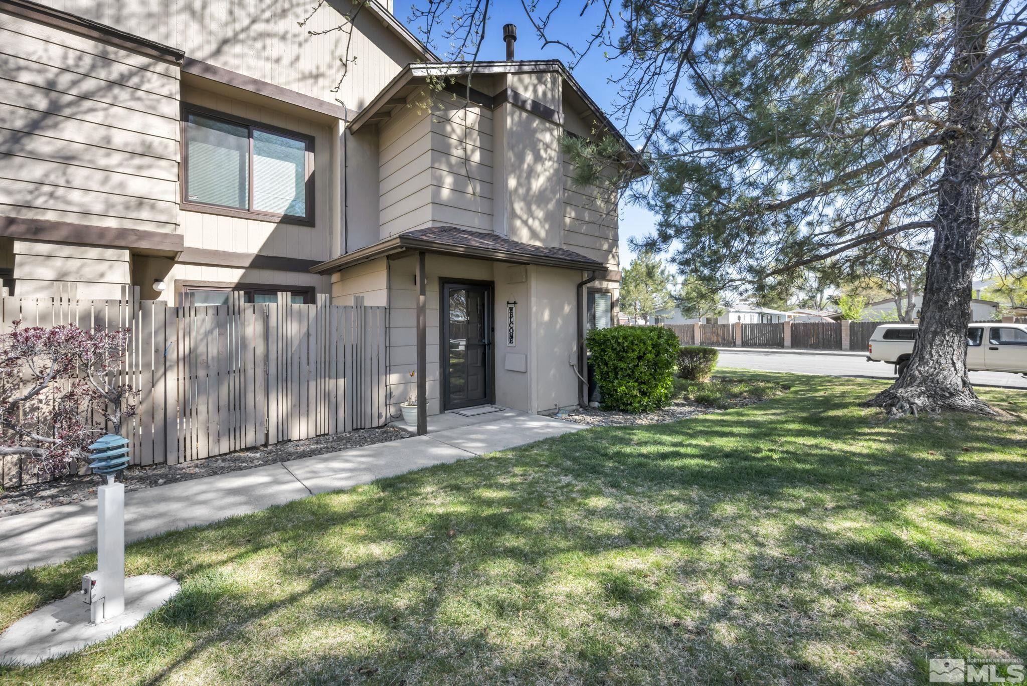 4721 Reggie Road Reno, NV 89502 - Photo 2 of 33 a front view of a house with a garden