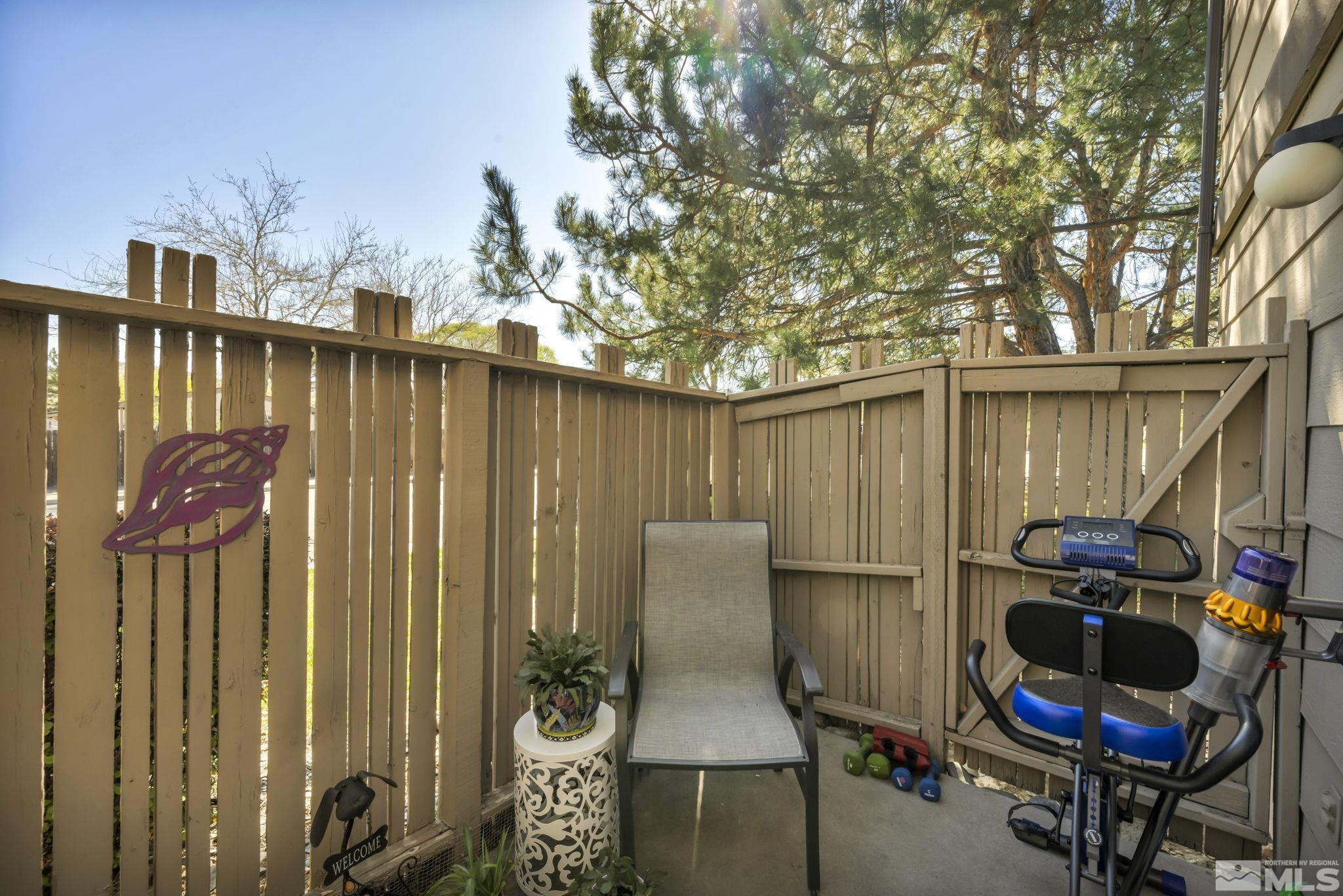 4721 Reggie Road Reno, NV 89502 - Photo 23 of 33 a backyard of a house with table and chairs