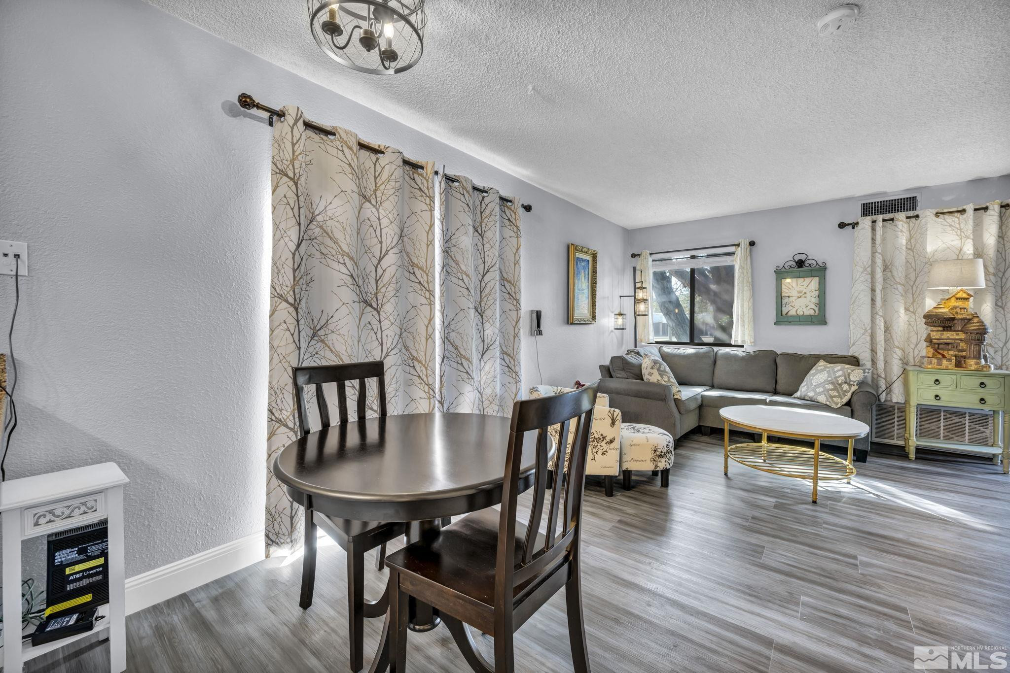 4721 Reggie Road Reno, NV 89502 - Photo 6 of 33 a living room with furniture and wooden floor