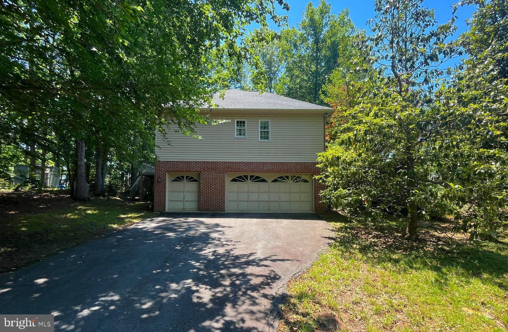 201 Green Street Locust Grove, VA 22508 - Photo 2 of 4 Second driveway with a 2 car and golf cart garage
