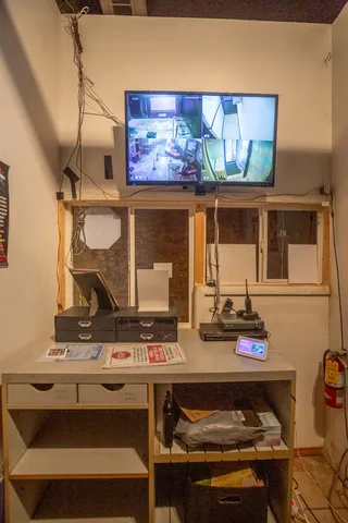 an aerial view of a house with a yard and potted plants