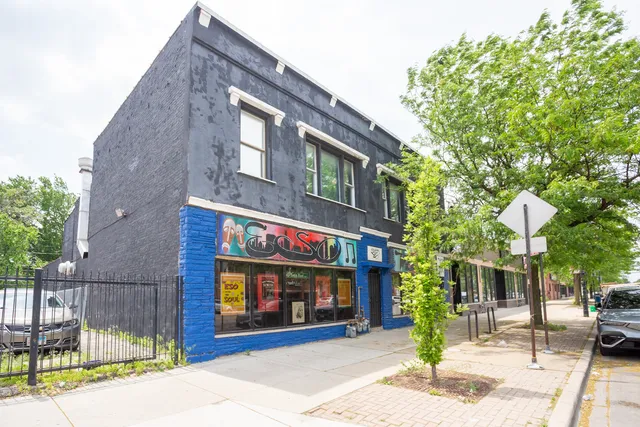 a view of a building with a street