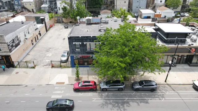 a terrace with outdoor seating and trees