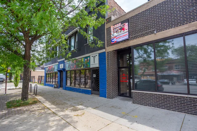 a view of a building with sitting area