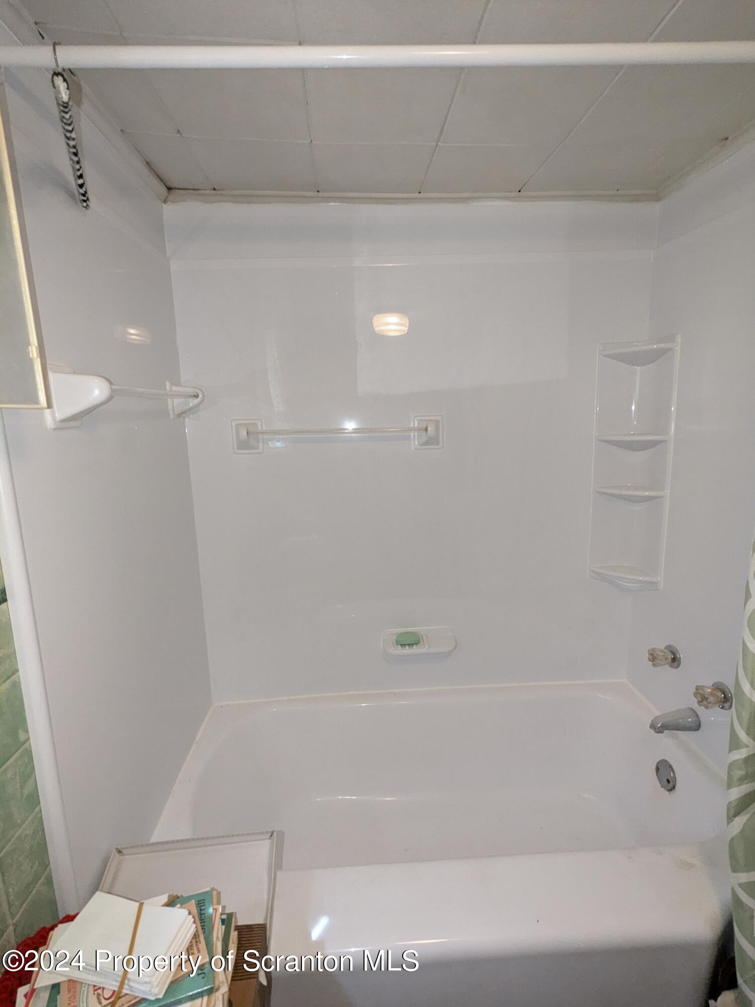 909 Battle Street Scranton, PA 18508 - Photo 8 of 11 a bathroom with a bathtub