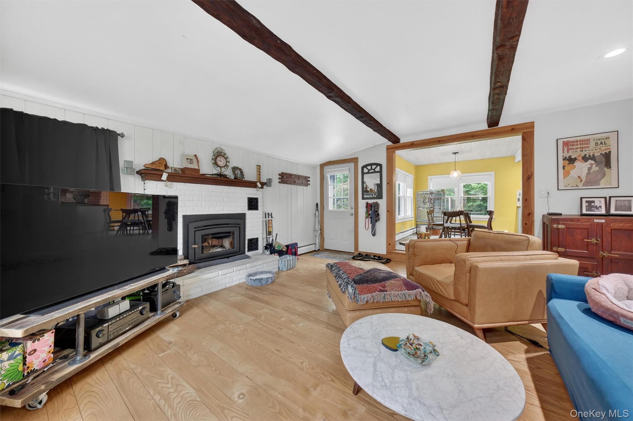 10 Edwin Road Poughkeepsie, NY 12603 - Photo 19 of 46 a living room with furniture a fireplace and a flat screen tv