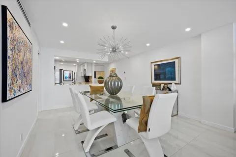 a view of a livingroom with furniture and a flat screen tv