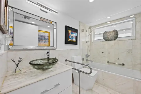 a bedroom with a large bed and a couch