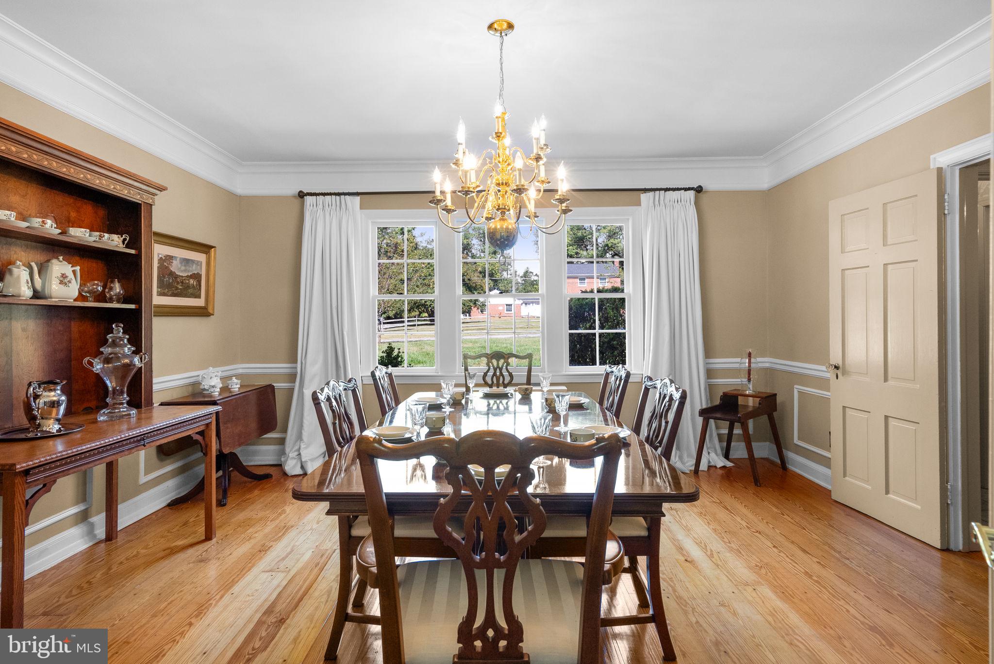 801 Notley Road Silver Spring, MD 20904 - Photo 12 of 42 a view of a dining room with furniture window and wooden floor