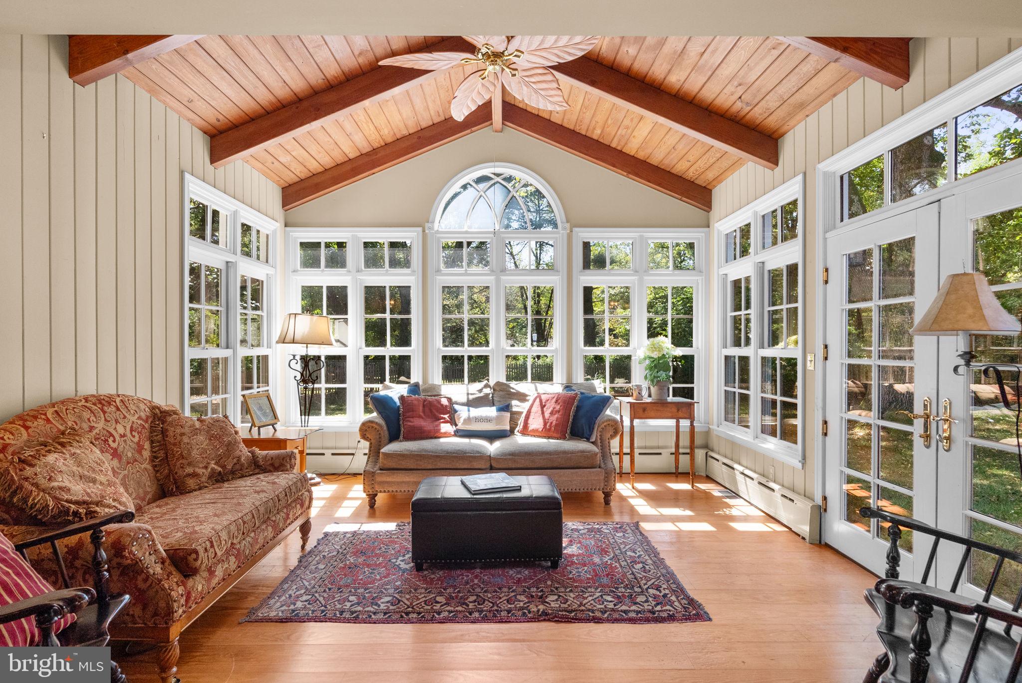 801 Notley Road Silver Spring, MD 20904 - Photo 2 of 42 a living room with furniture a large window and a chandelier
