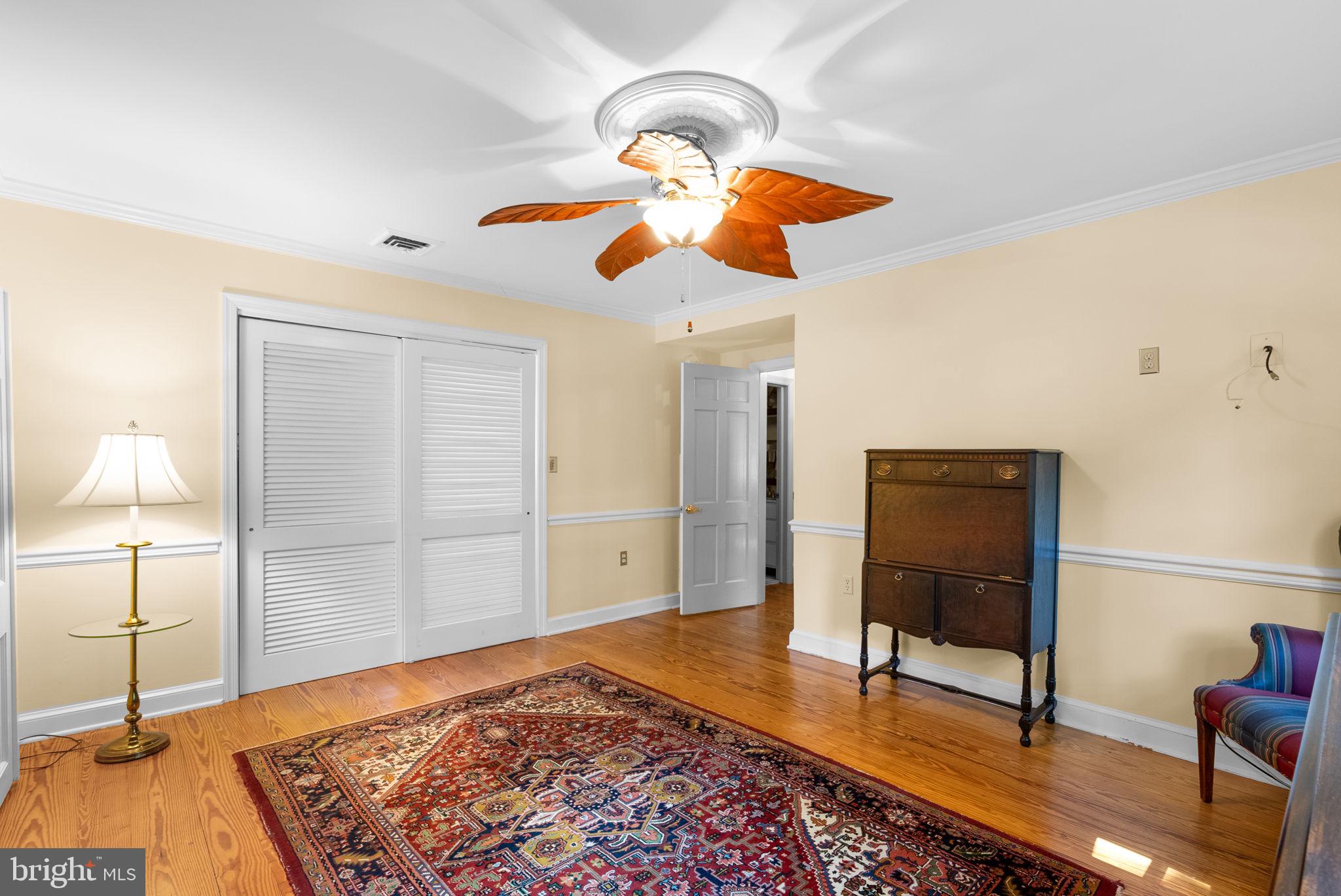 801 Notley Road Silver Spring, MD 20904 - Photo 24 of 42 a bedroom with a bed and a chandelier