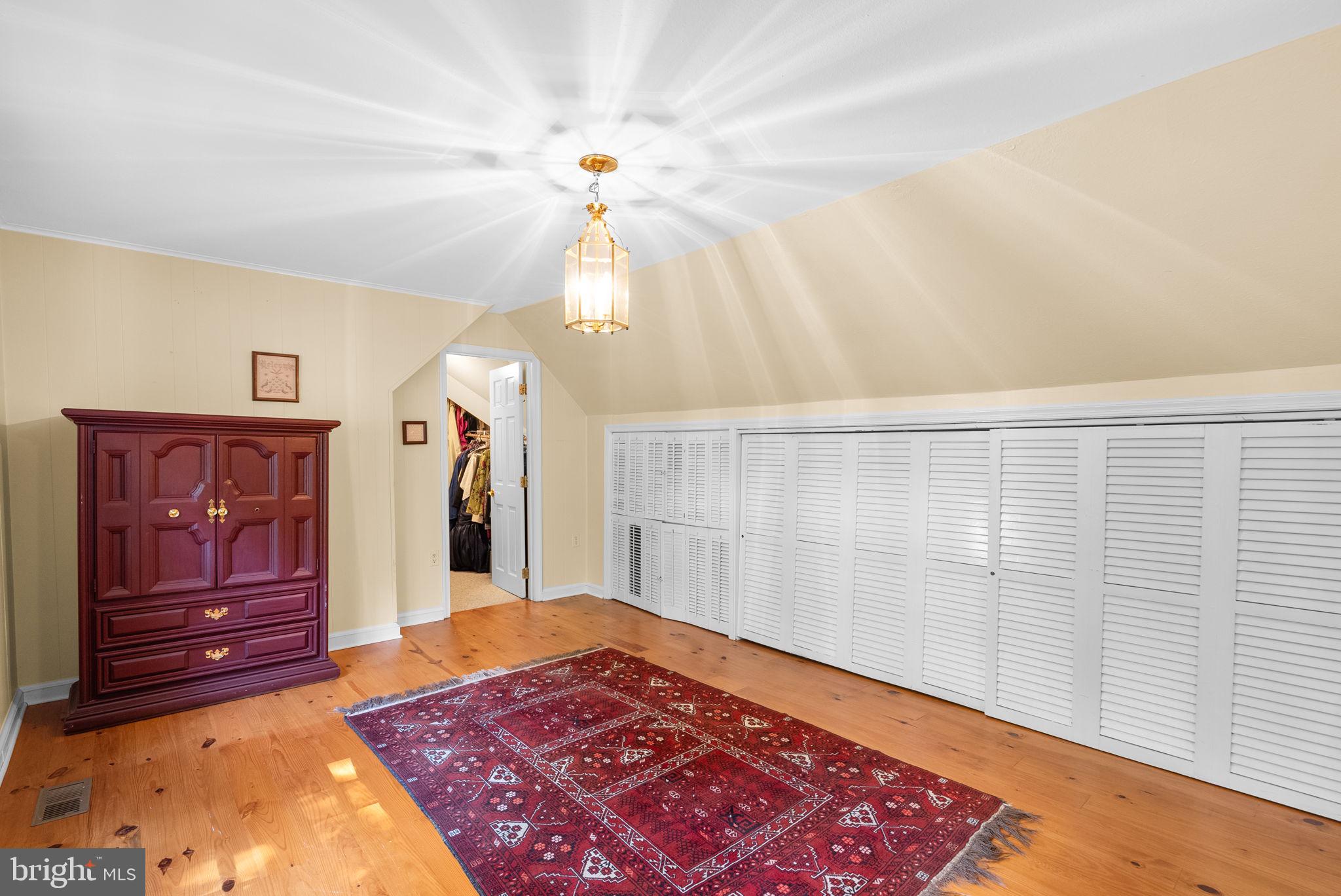 801 Notley Road Silver Spring, MD 20904 - Photo 27 of 42 a view of a hallway with closet and chandelier fan