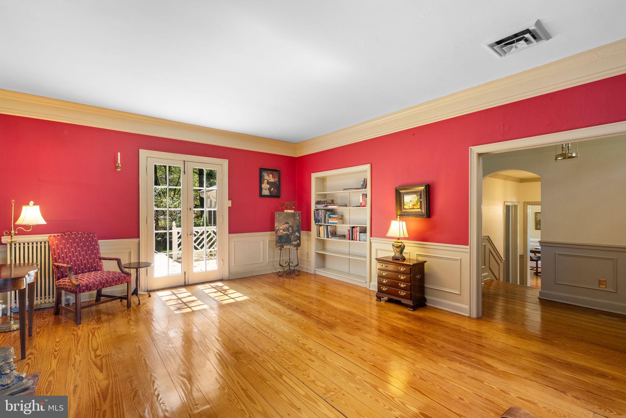 801 Notley Road Silver Spring, MD 20904 - Photo 8 of 42 a spacious bedroom with a bed and wooden floor