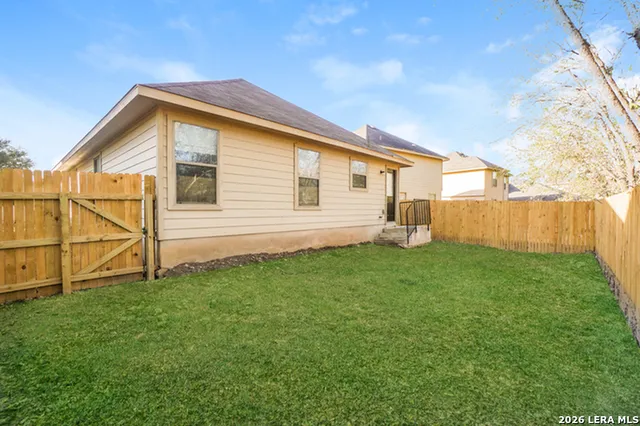 a backyard of a house with lots of green space