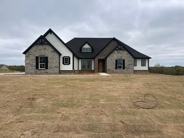 a house with trees in the background