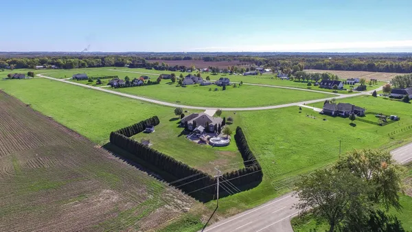 an aerial view of a golf course with a big yard