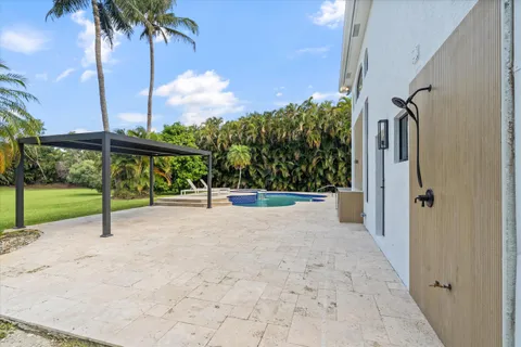 a view of swimming pool with a yard