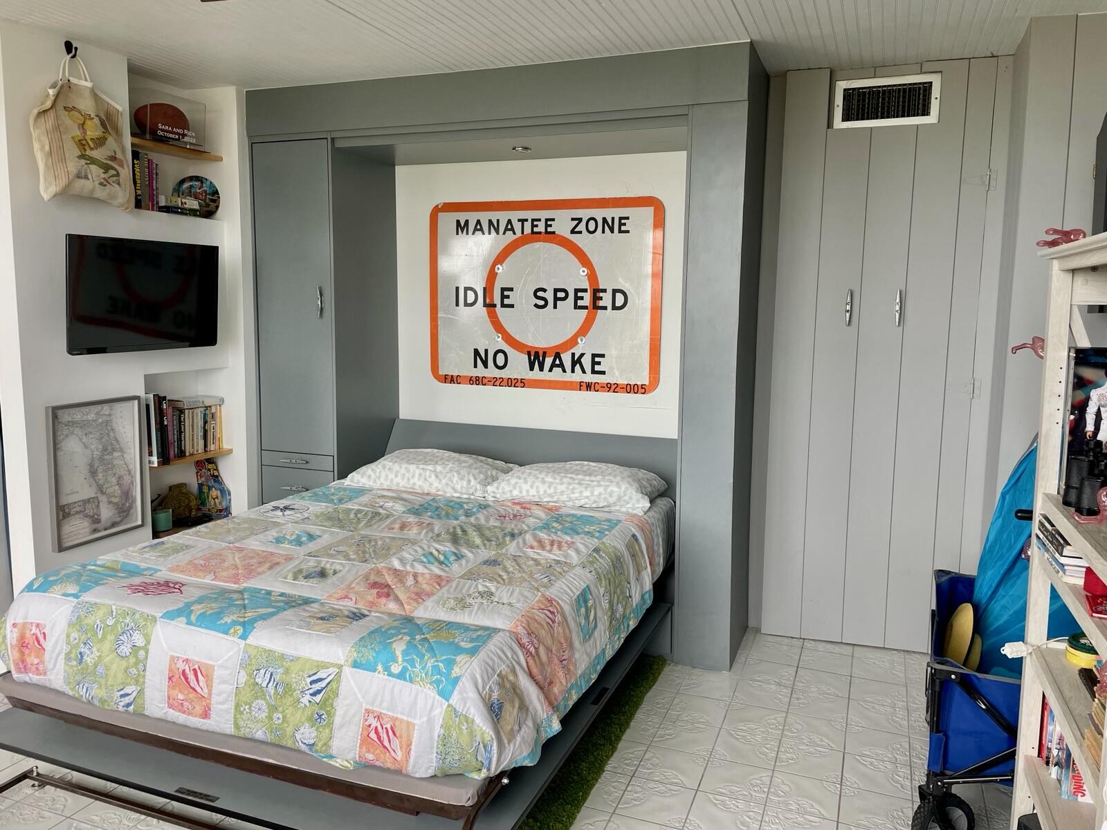 2121 North Ocean Boulevard, Unit 1204E Boca Raton, FL 33431 - Photo 14 of 21 a bedroom with a bed and a flat screen tv