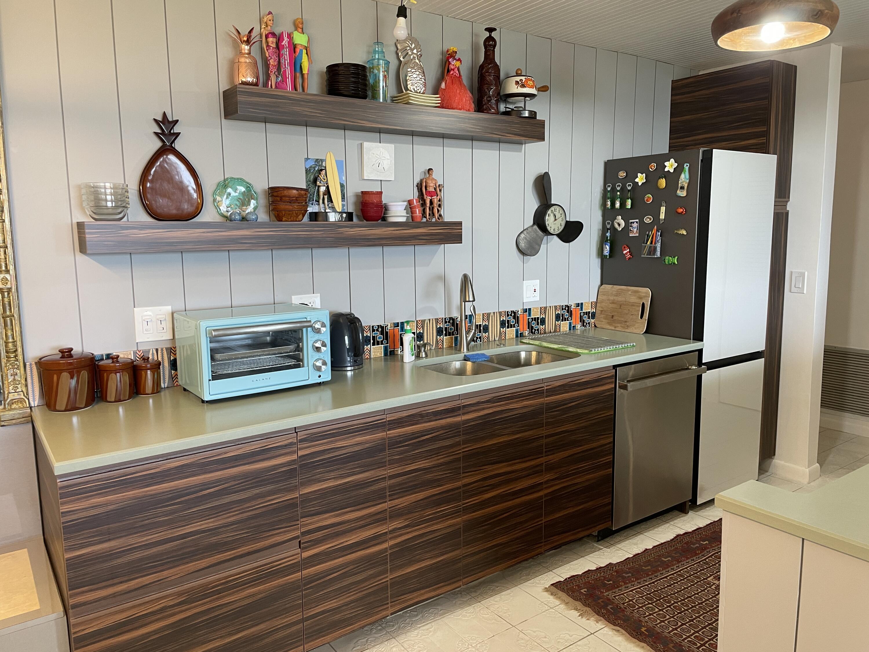 2121 North Ocean Boulevard, Unit 1204E Boca Raton, FL 33431 - Photo 5 of 21 a kitchen with stainless steel appliances granite countertop a sink and cabinets
