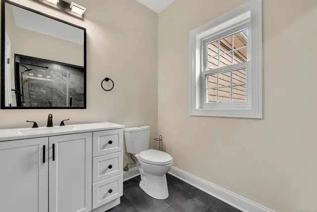 a view of entryway and hall with a front door