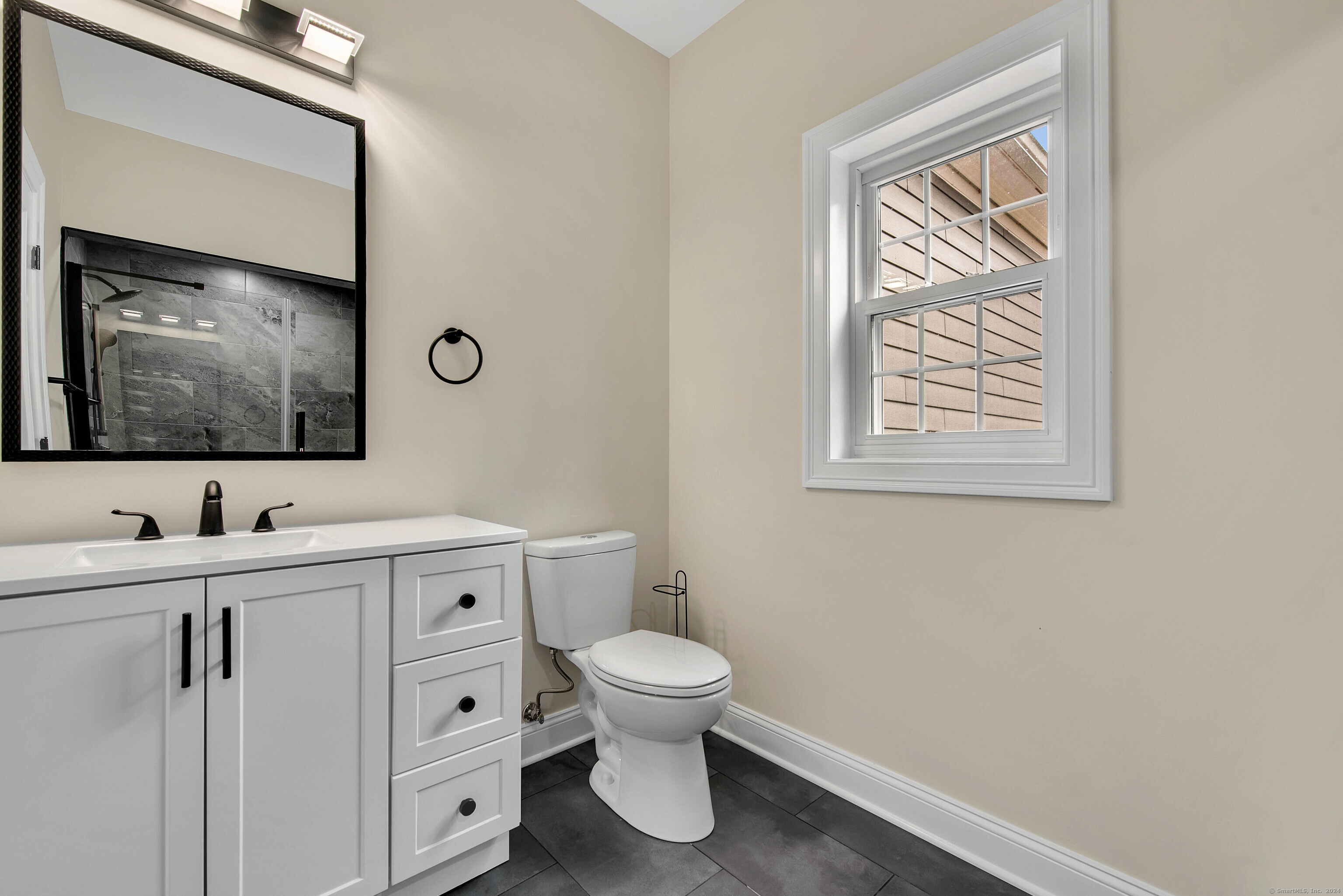 34 Fox Run Road Redding, CT 06896 - Photo 23 of 40 a bathroom with a toilet a sink and mirror