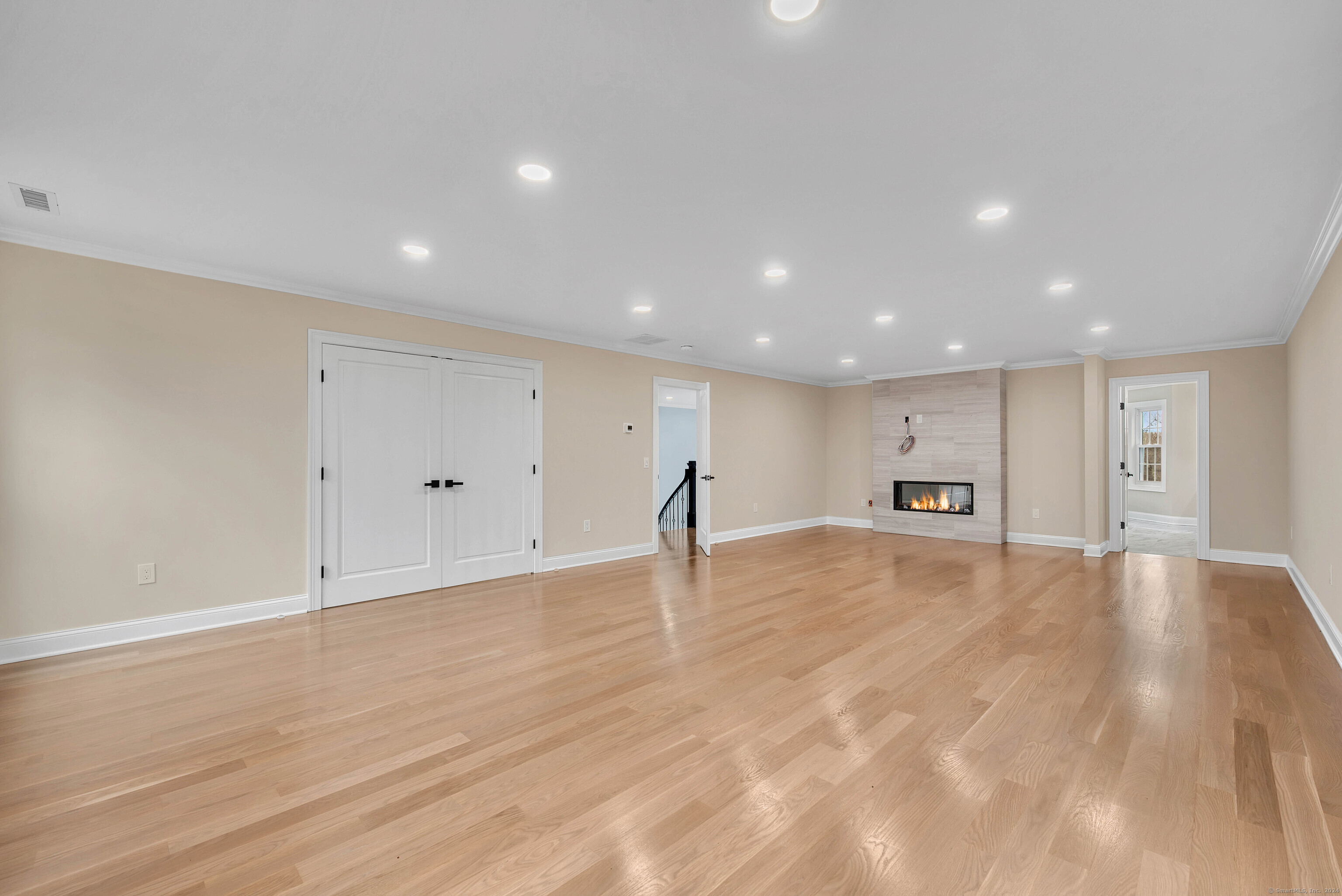 34 Fox Run Road Redding, CT 06896 - Photo 29 of 40 a view of empty room with wooden floor